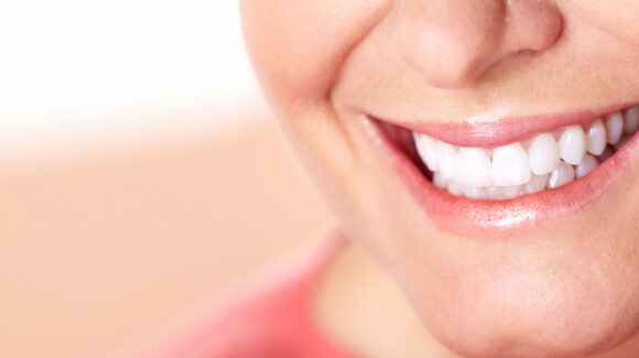 dental-patient-smiling-after-procedure-1-580x325